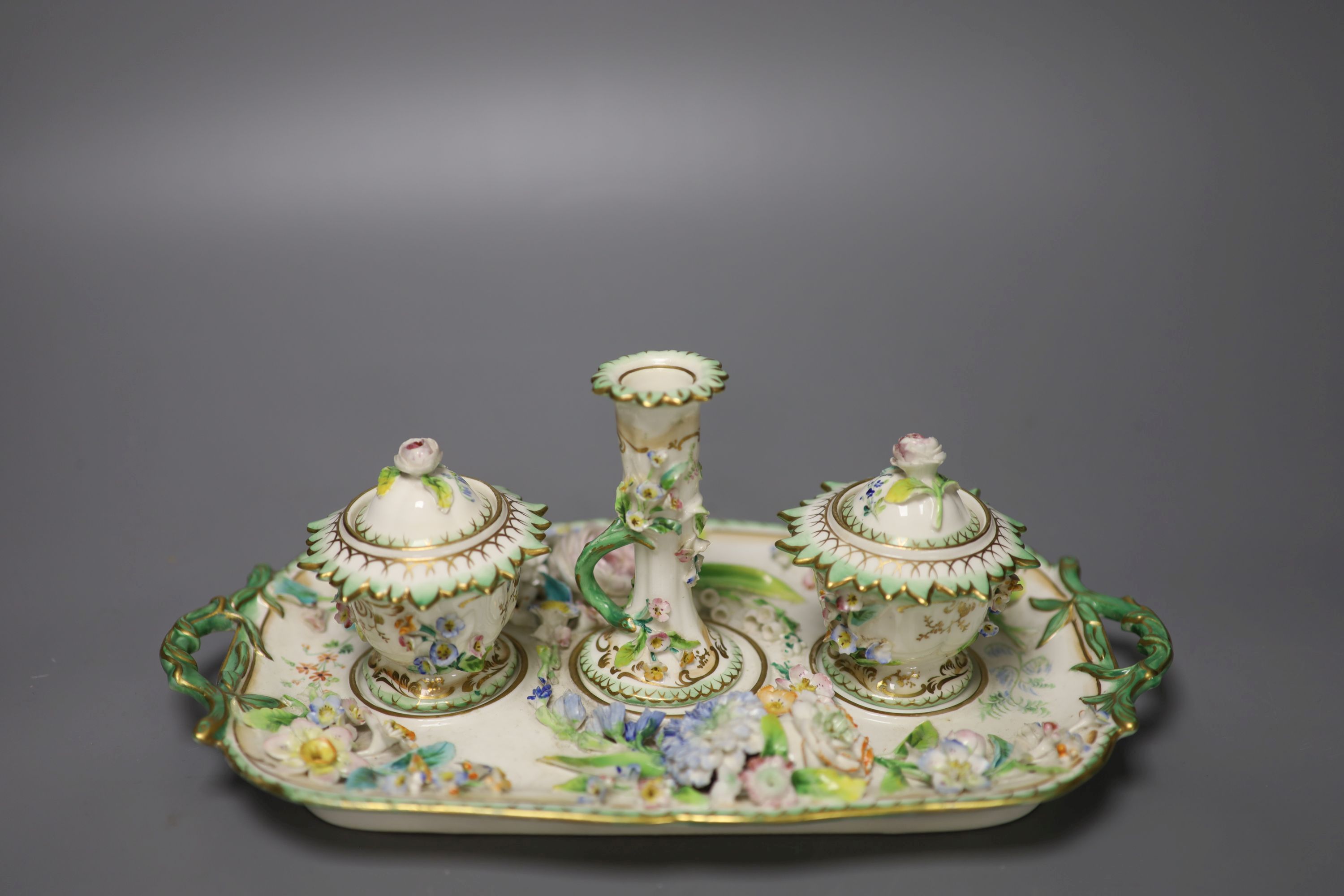 An English porcelain inkstand, of Coalbrookdale type painted and encrusted with flowers c.1830, length 27cm